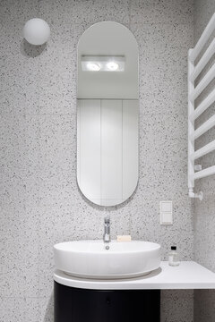 Modern Bathroom With Oval Mirror