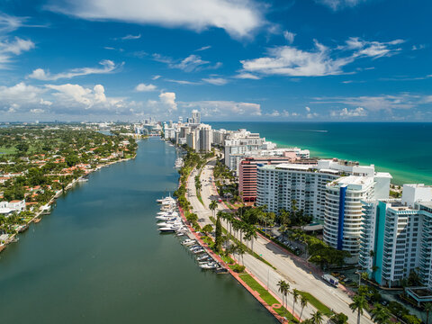 Aerial Miami Beach along Collins Avenue mid beach waterway with Yacht Marina and high rise condos