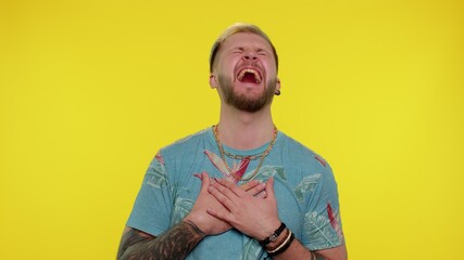 Sincere trendy stylish man 30s years old laughing out loud after hearing ridiculous anecdote, funny...