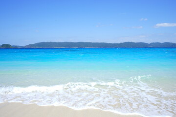 Beautiful summer scenery. calm waves on the blue water. Furuzamami Beach in Zamami island, Okinawa, Japan - 日本 沖縄 座間味島 古座間味ビーチ 青い海	