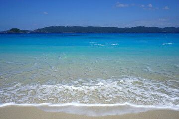 Beautiful summer scenery. calm waves on the blue water. Furuzamami Beach in Zamami island, Okinawa, Japan. Closeup - 日本 沖縄 座間味島 古座間味ビーチ 青い海
