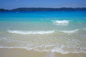 Beautiful summer scenery. calm waves on the blue water. Furuzamami Beach in Zamami island, Okinawa, Japan. Closeup - 日本 沖縄 座間味島 古座間味ビーチ 青い海