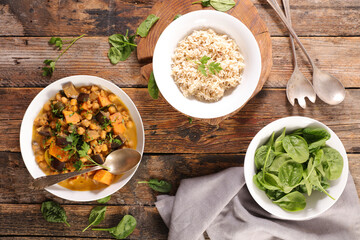 veggie bowl with aubergine and chickpea curry,  spinach and rice