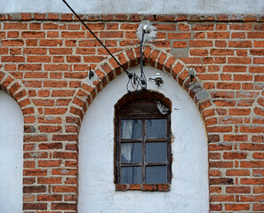 Obraz premium General view and architectural details in close. Catholic church dedicated to the Assumption of the Blessed Virgin Mary. Built in the second half of the 14th century in the town of Galiny, warmi in Po