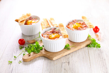 baked egg with bacon and bread toast