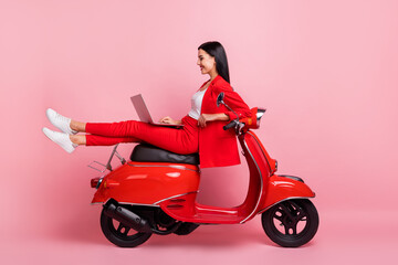 Full size profile side photo of young cheerful lovely businesswoman sit moped working in laptop...