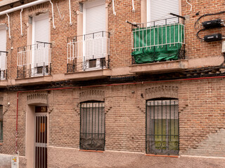 Fototapeta na wymiar POOR NEIGHBORHOOD IN SPAIN AREA STREET WITH CLOTHES AND GARBAGE