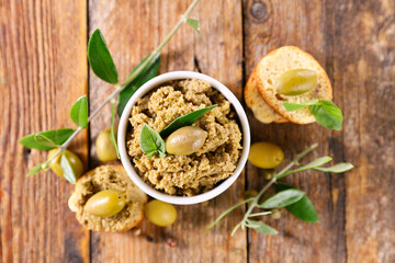 green olive tapenade and tree branch