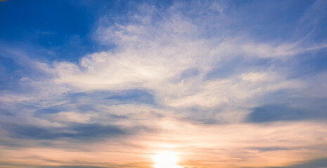 Fototapeta premium Cloudy blue sky with brightly sunset on evening.