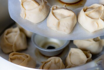 Ready-to-cook manti. Traditional meat dish of the peoples of Central Asia. Appetizing Dumpling.