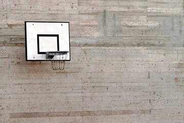 Basketball board and hoop net isolated on concrete background  with a lot of copy space. © Lucia