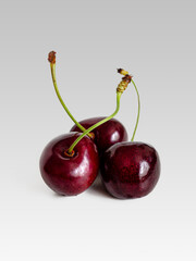 Ripe sweet cherry berries on a light background