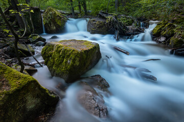 Waterfall cascades. Long exposure image of a wild forest river in Slovakia.
