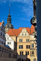 Old building with a tiled roof and a domed church in Europe