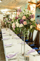 Beautiful floral compositions in the restaurant for the wedding ceremony