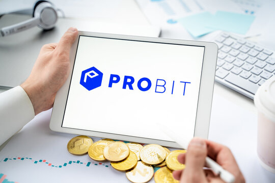 Russia Moscow 06.05.2021.Businessman with tablet.Logo of cryptocurrency stock exchange Probit.Trading blockchain platform to buy,sell digital crypto coins,tokens Bitcoin,Ethereum.Business,investing