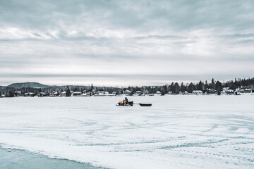 Snowmobile on frozen lake