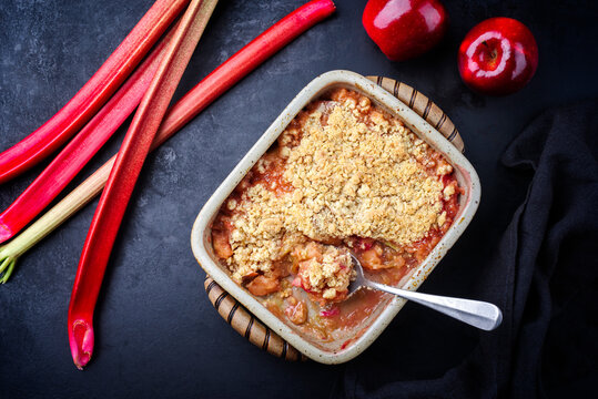 Traditional English Crumble Cake With Rhubarb And Apple With Backed Topping Served As Top View In Backing Form