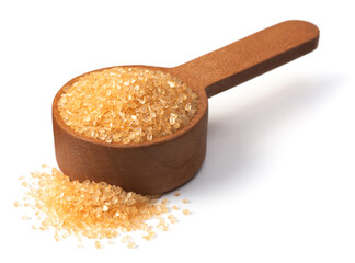 yellow sanding sugar in the wooden measuring spoon, isolated on white background