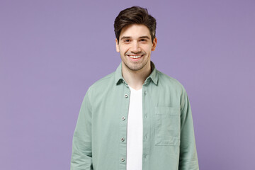 Young brunette smiling happy cheerful caucasian man 20s years old wearing casual mint shirt white...