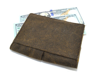 Money in wallet close-up on white background. Dollars, business, finance, economy, banknotes