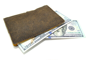 Money in wallet close-up on white background. Dollars, business, finance, economy, banknotes