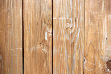 Naklejka premium Light brown wooden board with natural pattern, texture of a wooden wall background..