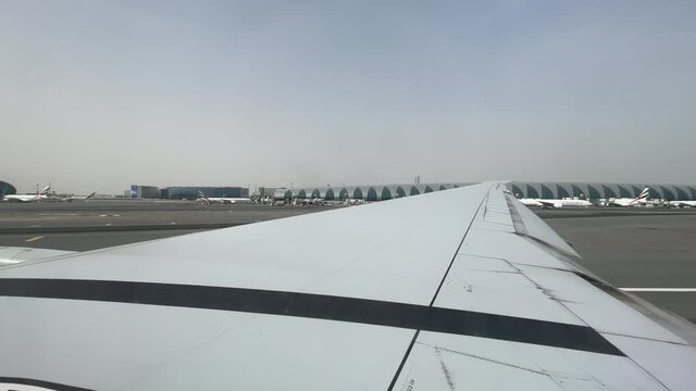 View from the window airplane taking off at Dubai international Airport