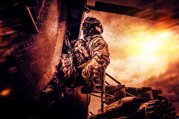 Image of a military man attached with a rope to a helicopter. Battlefield style. The concept of war...