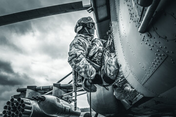 Soldier prepares to jump from a helicopter. The concept of computer games.