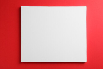 Fototapeta premium Blank canvas on red background, space for text