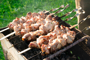 Shish kebab on the grill on the street.