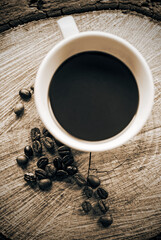 Cup of coffee and beanscoffee on a wood