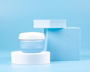 Cosmetic facial skin care with geometric figures on a blue