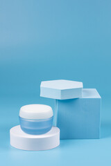 Cosmetic facial skin care with geometric figures on a blue