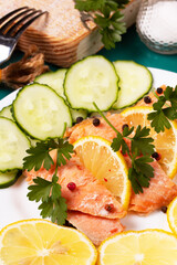 Trout baked in foil with lemon on the table