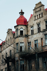 Fototapeta premium An old historic abandoned house with turrets and decorative ornaments on the facade. One of the main attractions of the city of Sovetsk, Kaliningrad Region