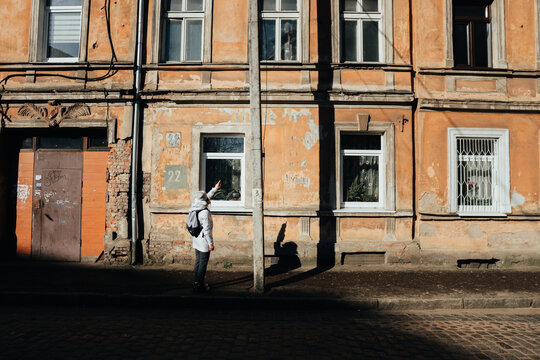 Girl points to old German inscriptions in Sovetsk (formerly Tilsit), Kaliningrad region