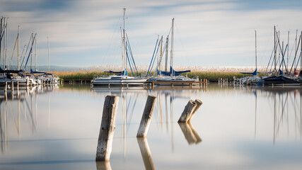 Marina with sailing boats at of City of Rust on lake Neusiedl  in Burgenland on a calm morning