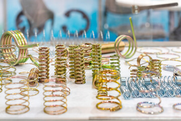 Various and many metal brass and zinc coating coil spring equipment part for different industrial purposes
