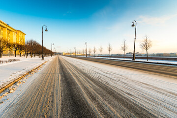 Empty city embankment in winter day. View from the road