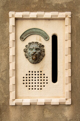 Old metal door handle in the form of a lion head. Door knocker closeup. Venice, Italy