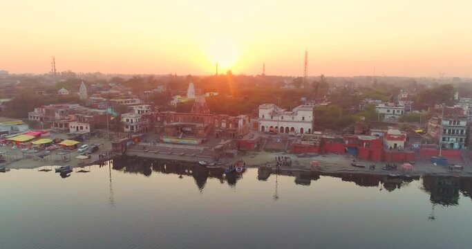 Cinematic Aerial View of Brahmavart Ghat, Sunset Near River Ganga, Kanpur, Uttar Pradesh, India.