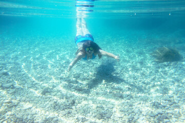 Woman swimming underwater