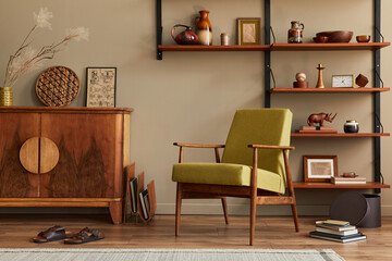 Modern retro concept of living room interior with stylish armchair, wooden shelf, book, picture...