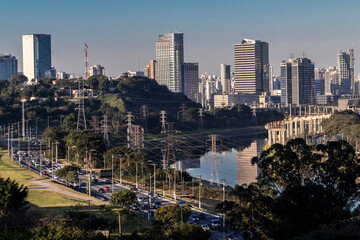 Fototapeta premium City skyline, with Marginal Avenue and Pinheiros River in the foreground, in the south zone of Sao Paulo, Brazil