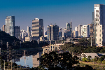 Fototapeta premium City skyline, with Marginal Avenue and Pinheiros River in the foreground, in the south zone of Sao Paulo, Brazil