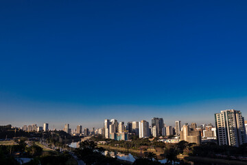 Obraz premium City skyline, with Marginal Avenue and Pinheiros River in the foreground, in the south zone of Sao Paulo, Brazil