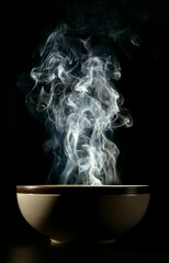 Picture of smoke rising from the food above the cup The concept of hot food.