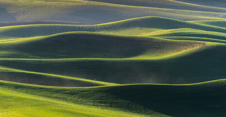 View of Farmland rolling hill with dramatic sunset light from Steptoe Butte State Park in Washington - obrazy, fototapety, plakaty